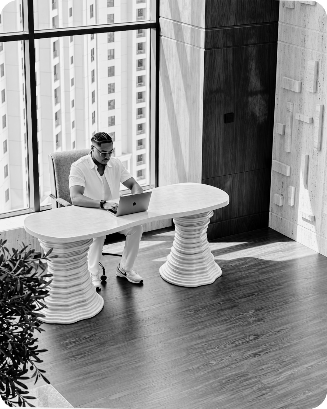 Mr. Opulent, founder of Advertising.Capital, working at his desk